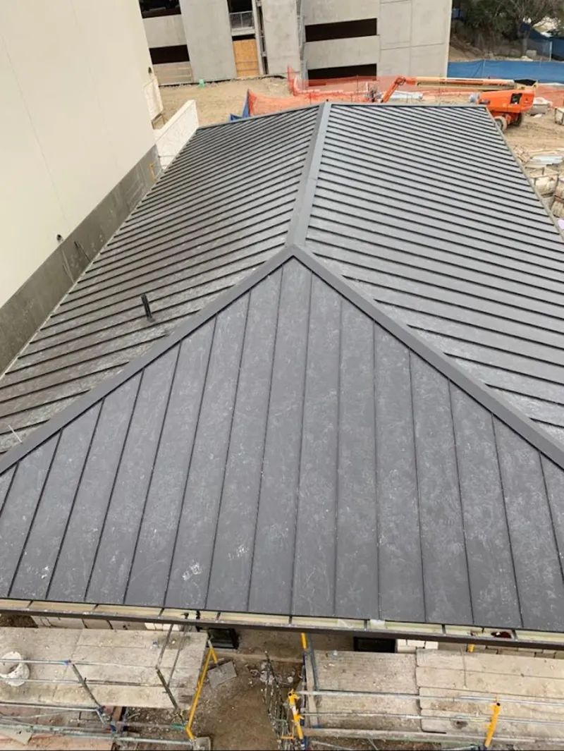 Commercial metal roof construction with crane equipment in Mukwonago