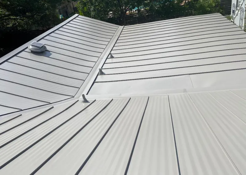 Solar attic fan installed on a metal roof for Roof Ventilation in Mukwonago